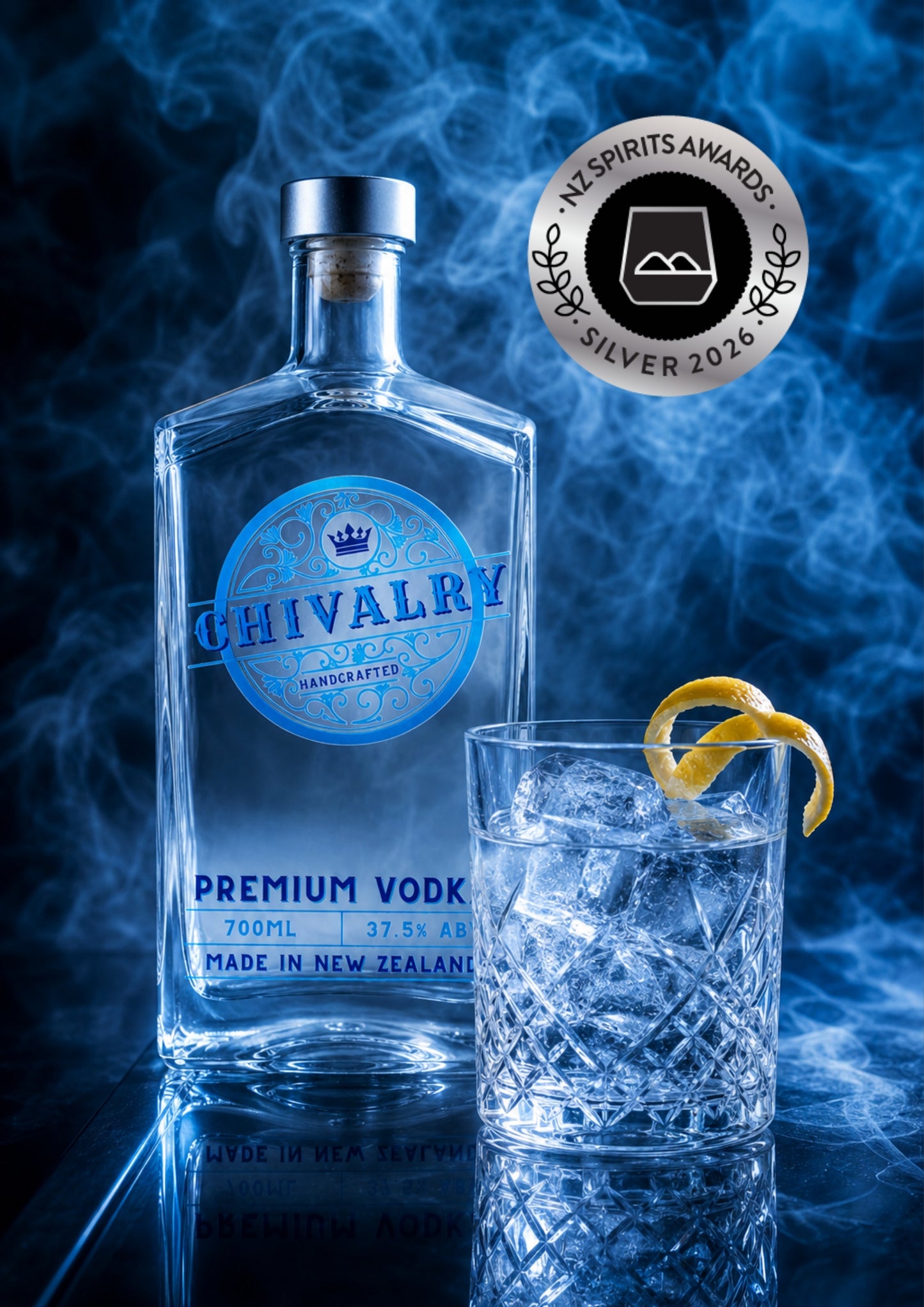 A bottle of Chivalry Premium Vodka stands beside a clear glass filled with ice and a curled lemon twist, set against a smoky blue background. A round award badge for the 2026 Spirits Awards is visible in the upper right.