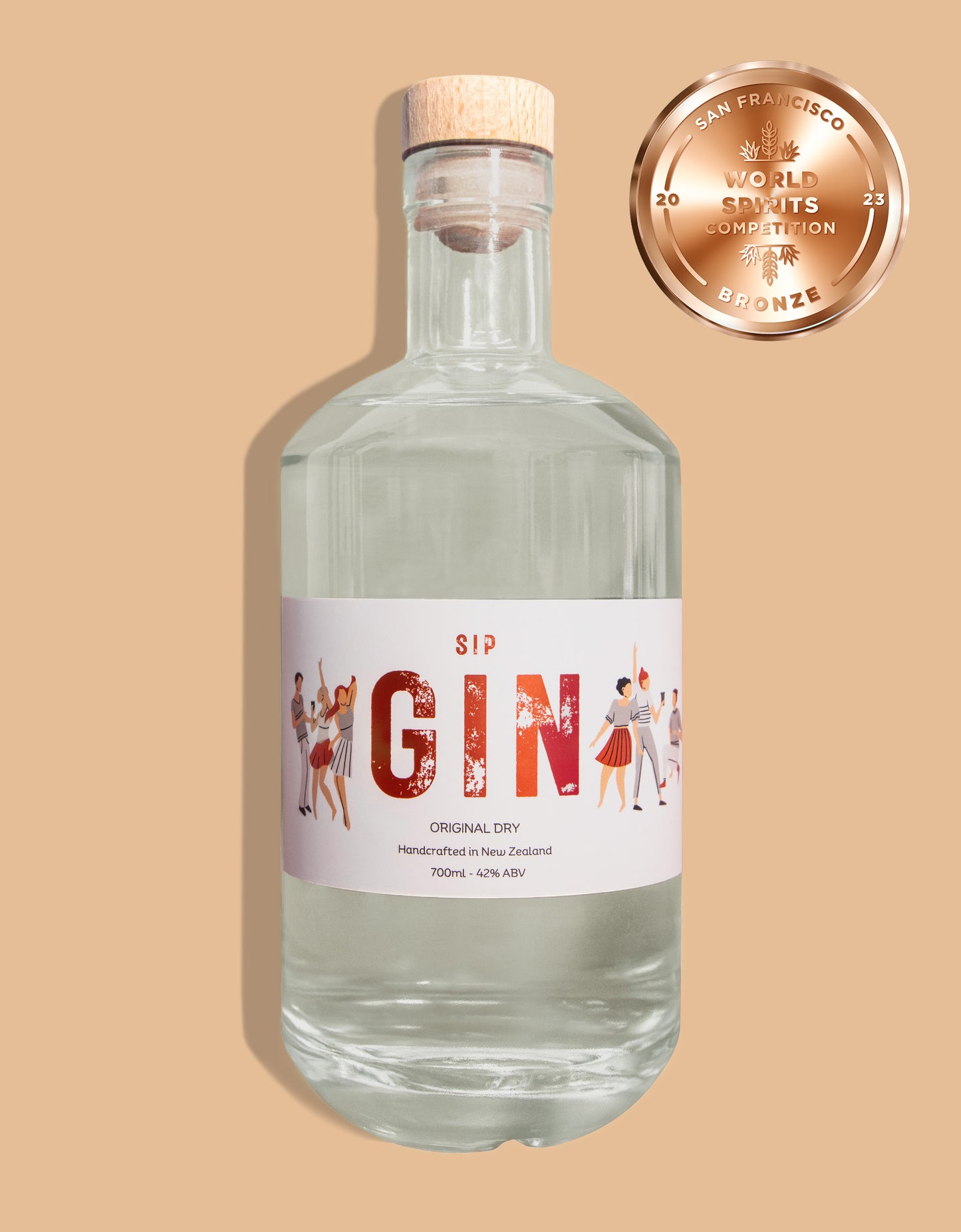 A clear bottle of Original Dry Gin with a label featuring illustrations of people and text, alongside a bronze world San Francisco spirit award seal.