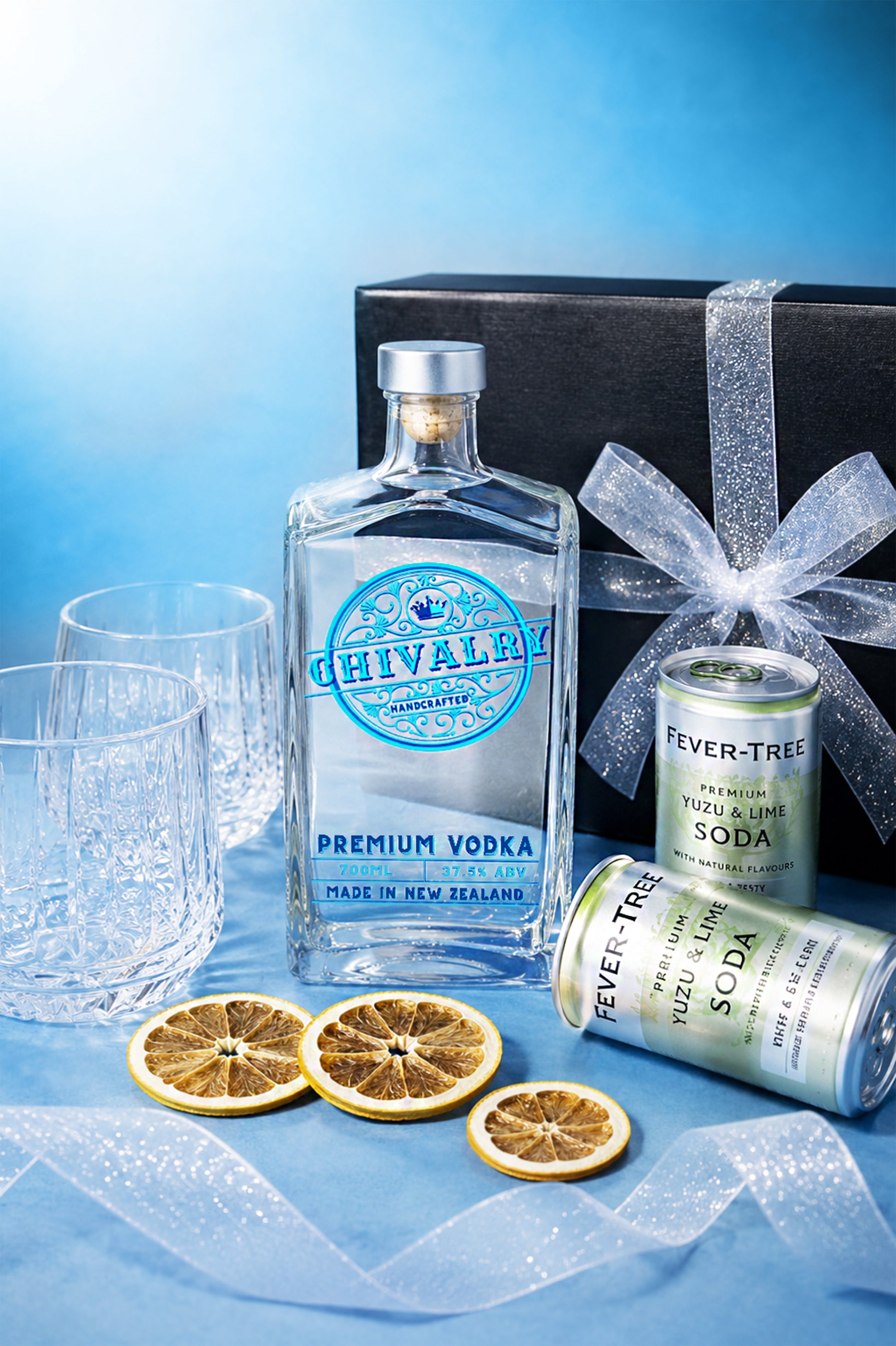 Chivalry vodka bottle with orange slices and Fever-Tree soda can on a blue background