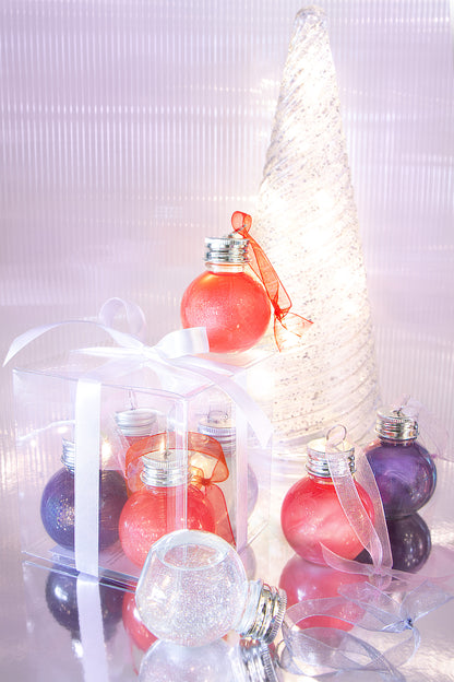 Decorative Christmas ornaments with ribbons on a white background