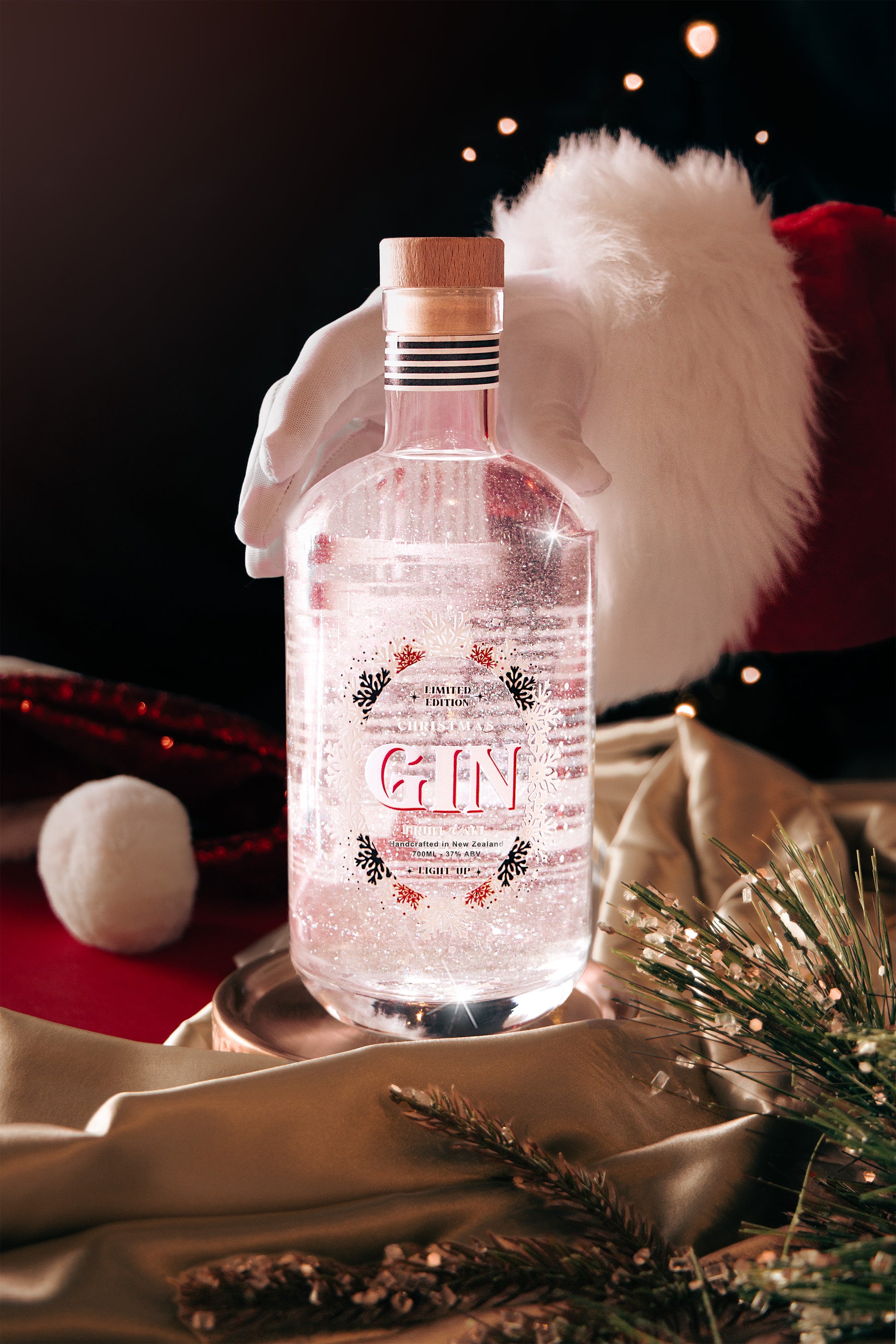 Bottle of gin with decorative elements on a festive background