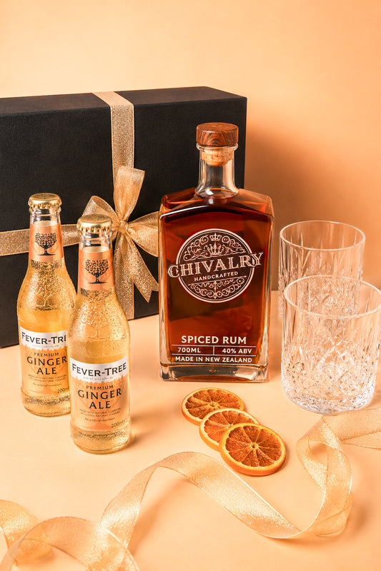 Chivalry Spiced Rum bottle with Fever-Tree Ginger Ale bottles and decorative elements on a beige background