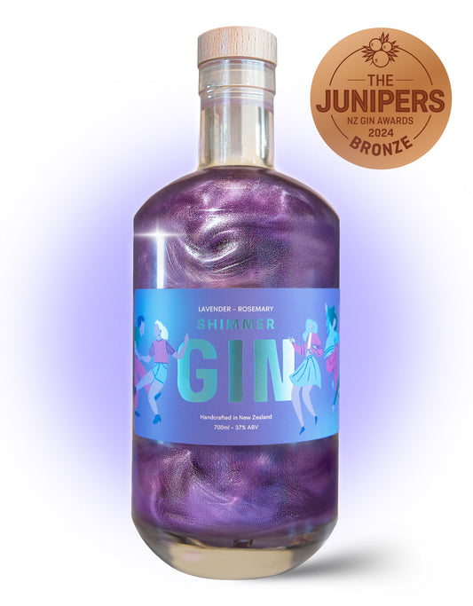 Bottle of Shimmer Gin with a purple label on a white background, featuring the Junipers NZ Gin Awards bronze badge.