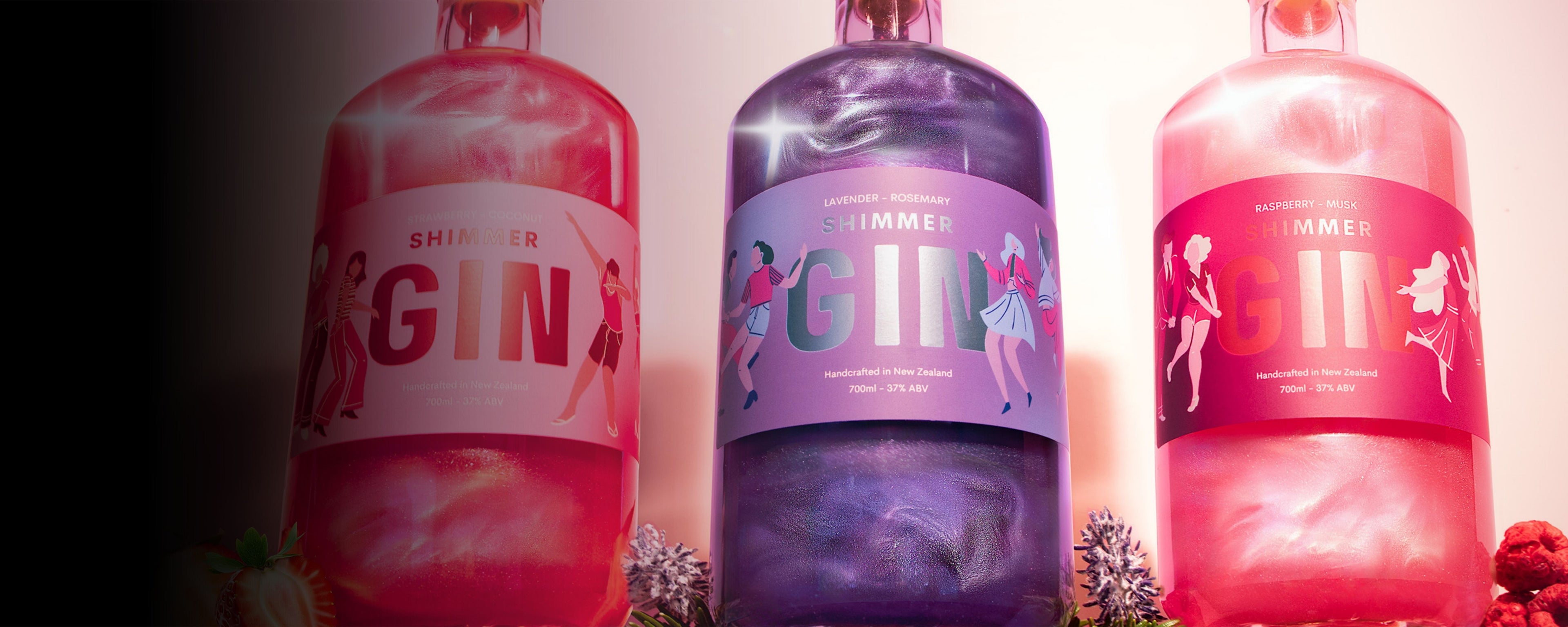Three bottles of Gin with colorful labels on a gradient background